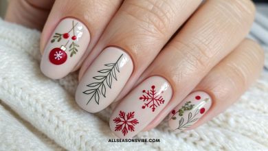 Classy Christmas nails with subtle red and neutral holiday designs