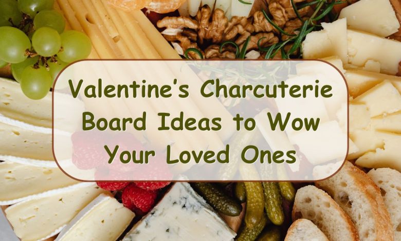 Beautiful Valentines charcuterie board with pink and red treats arranged in heart shapes