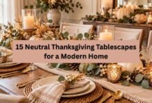 Neutral Thanksgiving tablescape with white pumpkins, beige linen, eucalyptus, and elegant table settings